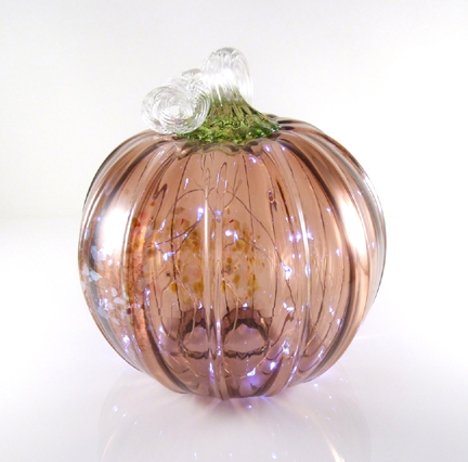 Blown pumpkins with openings underneath, designed to be filled with LED string lights (lights not included but optional with purchase). Approx. 6" x 6"