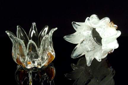 Tea light candle holders. Solid sculpted glass. Available in clear glass or many color options. Approx. 4"x 3"