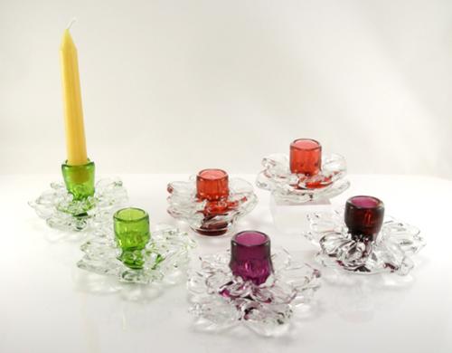 Candle stick holders. Blown and solid sculpted glass. Approx. 2" h x 3.5-4" w