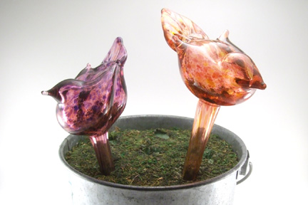 Blown glass and free hand sculpted house plant waterers. Fill with water and stick in plants to add a few days watering to your plants while your away. Sizes and shapes vary, each is unique. Approx. 10"L x 4"W
