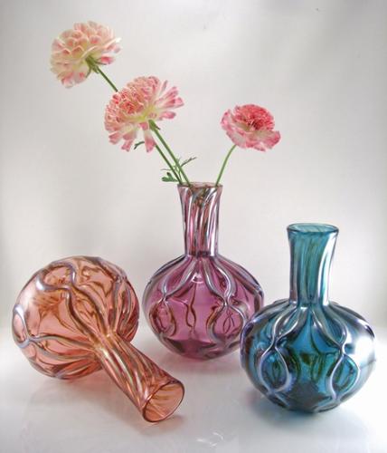 Blown glass flower vase. Available in many color options. Approx. 7-9" h x 5-6" w 