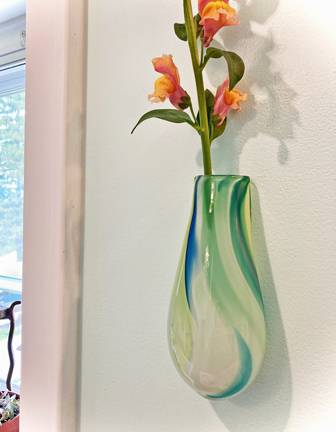 Wall Vase. Hangs on a nail. Color is unique in each piece and cannot be replicated. Fill with fresh or dried flowers, root house plants or use as a scented oil diffuser. Approx. 5-7" L x 3" W x 2" D